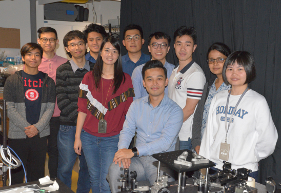 Dr Tsia with his research team in his research laboratory.